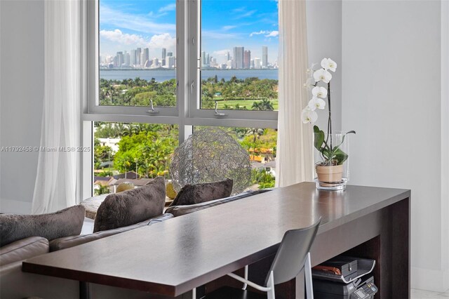 dining area featuring a view of city and a water view