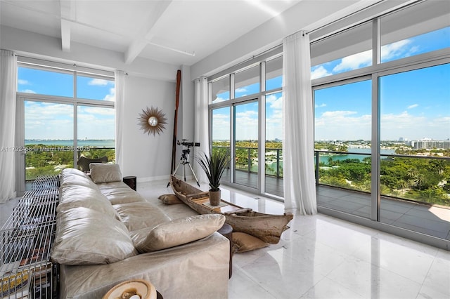 interior space featuring a water view and beam ceiling