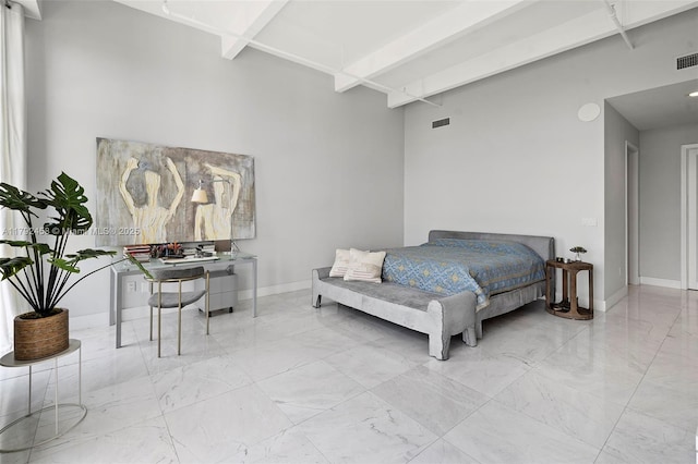 bedroom featuring baseboards, visible vents, and marble finish floor