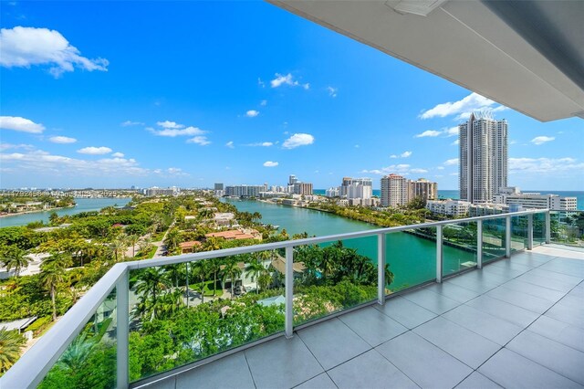 balcony with a city view and a water view