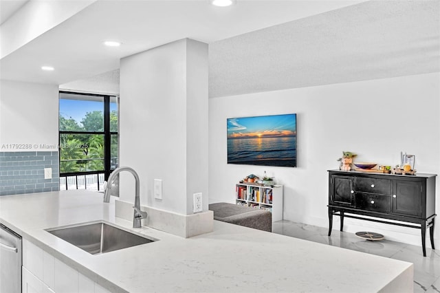 1000 Parkview Dr Unit 329, Hallandale Beach, FL 33009 - kitchen with recessed lighting, a sink, white cabinetry, and marble finish floor