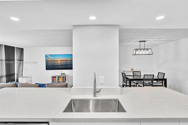 1000 Parkview Dr Unit 329, Hallandale Beach, FL 33009 - kitchen with recessed lighting, a sink, a textured ceiling, and open floor plan