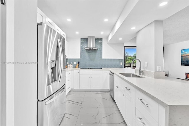 1000 Parkview Dr Unit 329, Hallandale Beach, FL 33009 - kitchen with a peninsula, recessed lighting, wall chimney exhaust hood, a sink, and appliances with stainless steel finishes