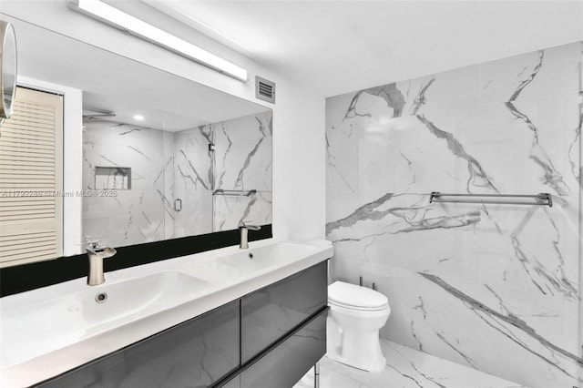 1000 Parkview Dr Unit 329, Hallandale Beach, FL 33009 - bathroom featuring double vanity, toilet, visible vents, and a sink
