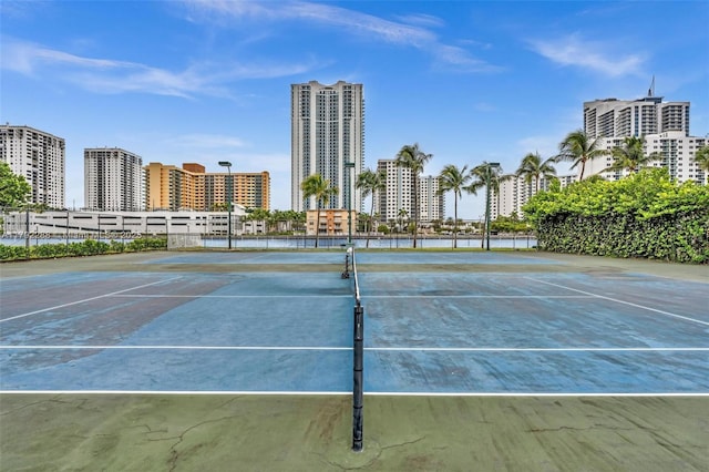 1000 Parkview Dr Unit 329, Hallandale Beach, FL 33009 - view of sport court featuring fence, a view of city, and community basketball court