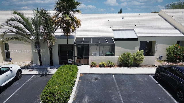 view of building exterior featuring uncovered parking