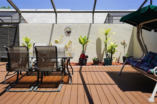 wooden deck with outdoor dining area