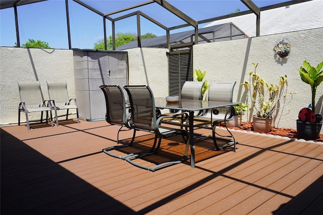wooden terrace with outdoor dining space