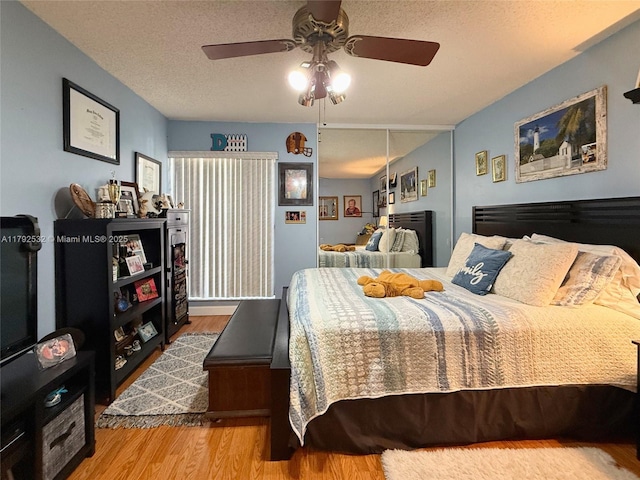 bedroom featuring a ceiling fan and wood finished floors