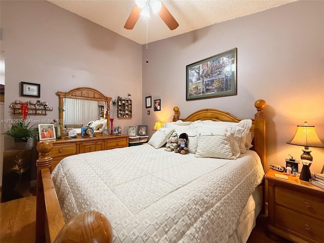 bedroom featuring a ceiling fan and wood finished floors