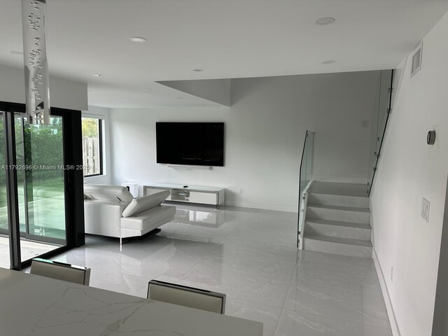6711 SW 127th Pl, Miami, FL 33183 - living room with recessed lighting, baseboards, and visible vents