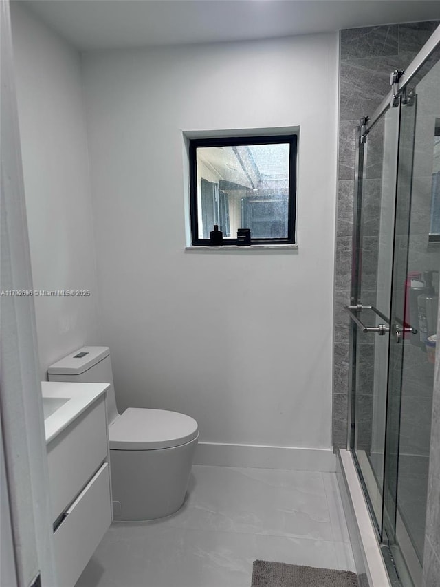 6711 SW 127th Pl, Miami, FL 33183 - bathroom with vanity, toilet, marble finish floor, and a stall shower