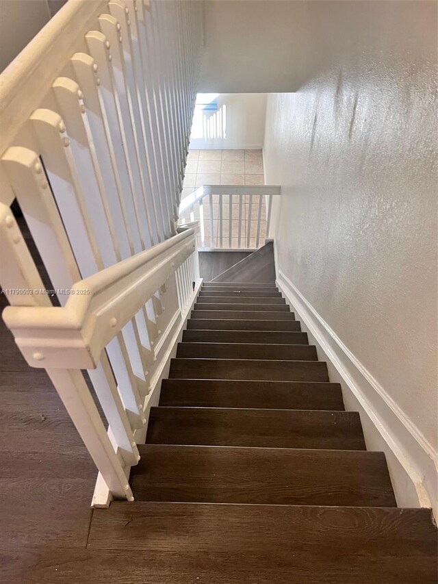 112 SE 28th Ter Unit 4, Homestead, FL 33033 - stairway featuring baseboards and wood finished floors