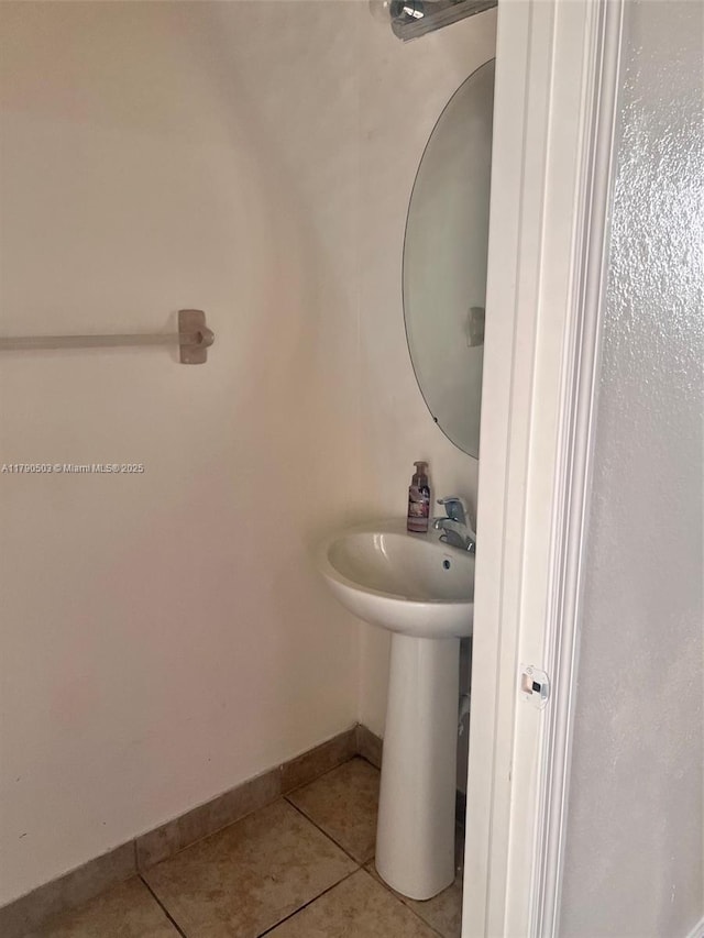 112 SE 28th Ter Unit 4, Homestead, FL 33033 - bathroom with baseboards and tile patterned flooring