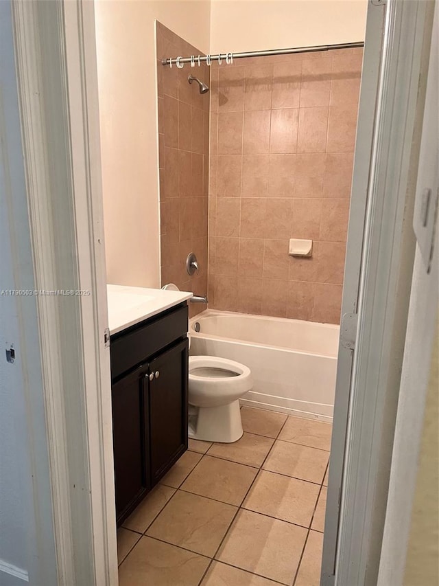 112 SE 28th Ter Unit 4, Homestead, FL 33033 - bathroom featuring vanity, washtub / shower combination, tile patterned floors, and toilet