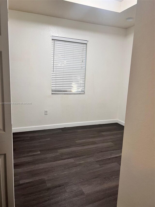 112 SE 28th Ter Unit 4, Homestead, FL 33033 - empty room with baseboards and dark wood-style floors