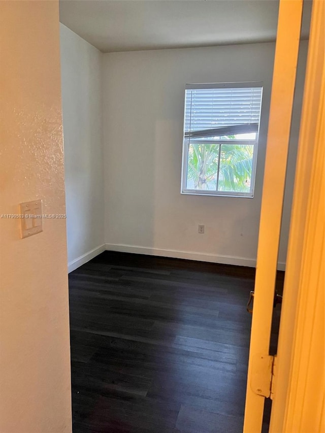 112 SE 28th Ter Unit 4, Homestead, FL 33033 - unfurnished room featuring baseboards and dark wood-style floors