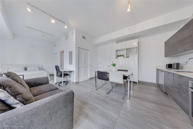 151 SE 1st St Unit 1706, Miami, FL 33131 - living area with light wood-style floors, baseboards, rail lighting, and visible vents