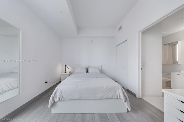 151 SE 1st St Unit 1706, Miami, FL 33131 - bedroom with light wood-type flooring and visible vents