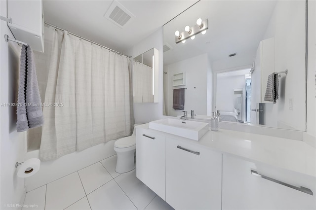 151 SE 1st St Unit 1706, Miami, FL 33131 - bathroom with visible vents, vanity, toilet, tile patterned floors, and shower / bath combo