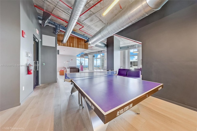 151 SE 1st St Unit 1706, Miami, FL 33131 - rec room with baseboards, a high ceiling, and wood finished floors