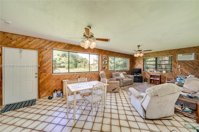 5709 Mckinley St, Hollywood, FL 33021 - living area with a ceiling fan, a wall mounted air conditioner, and wood walls