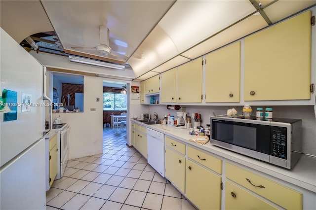5709 Mckinley St, Hollywood, FL 33021 - kitchen featuring a sink, white appliances, light countertops, a ceiling fan, and light tile patterned floors