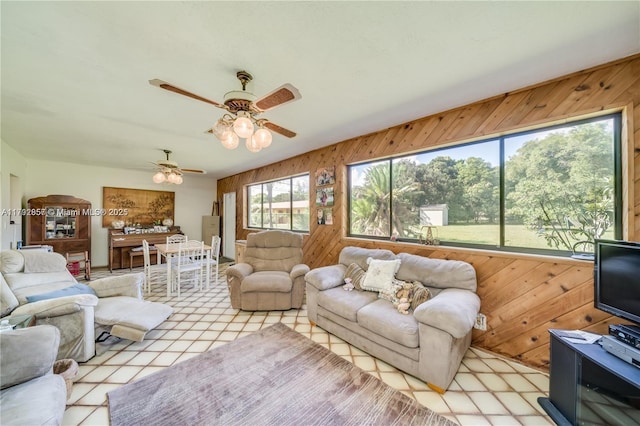 5709 Mckinley St, Hollywood, FL 33021 - living area featuring ceiling fan and wood walls