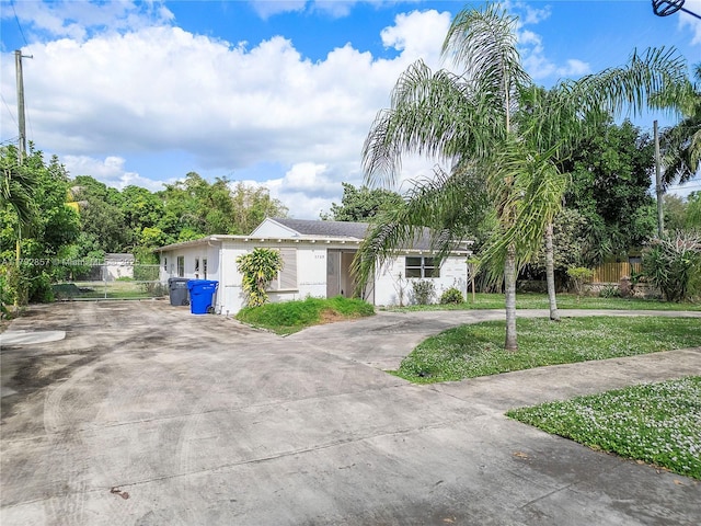 5709 Mckinley St, Hollywood, FL 33021 - ranch-style house with fence, concrete driveway, and a front yard