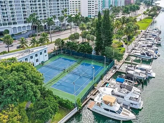 5401 Collins Ave Unit 614, Miami Beach, FL 33140 - view of tennis court featuring a water view