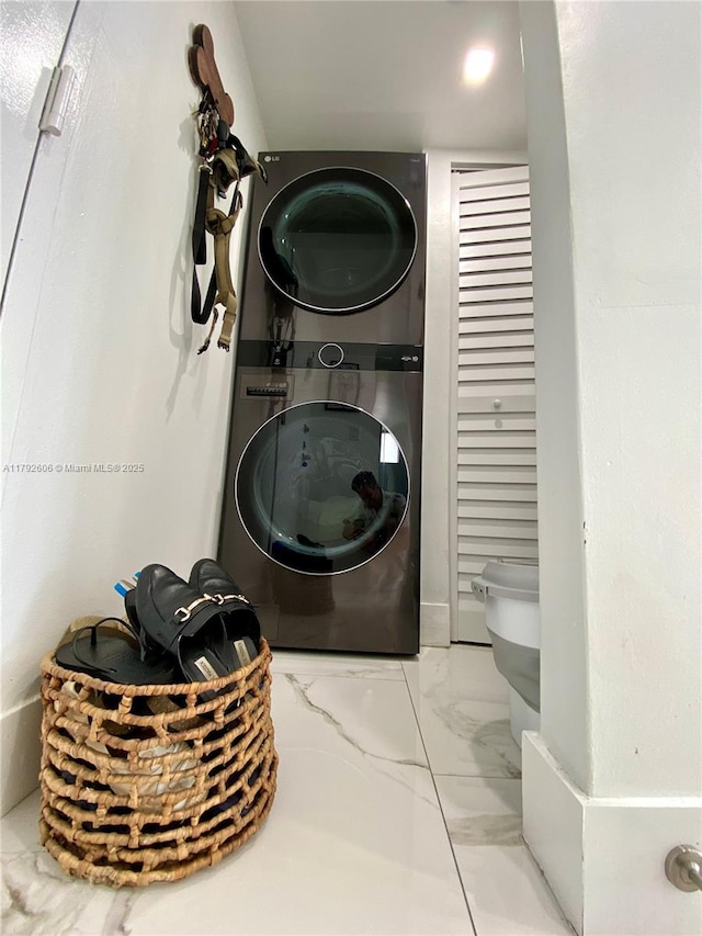 1700 NW N River Dr Unit 501, Miami, FL 33125 - laundry area with stacked washer / drying machine, marble finish floor, and laundry area