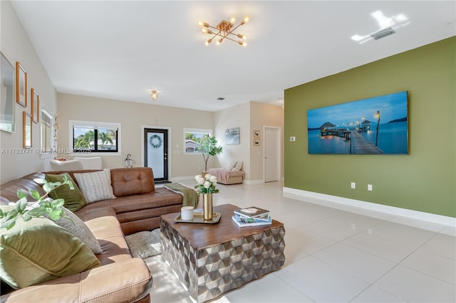 6470 SW 33rd St, Miami, FL 33155 - living area with healthy amount of natural light, tile patterned flooring, baseboards, and a chandelier