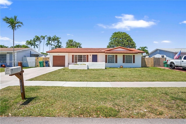 single story home with fence, a front yard, an attached garage, driveway, and a tile roof