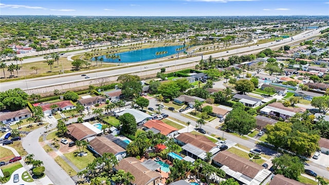 bird's eye view featuring a residential view and a water view