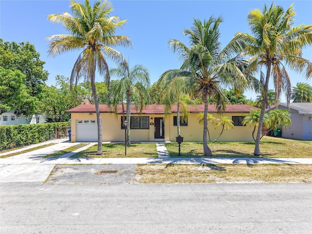 4515 SW 83rd Ave, Miami, FL 33155 - single story home with an attached garage, a front lawn, stucco siding, and driveway