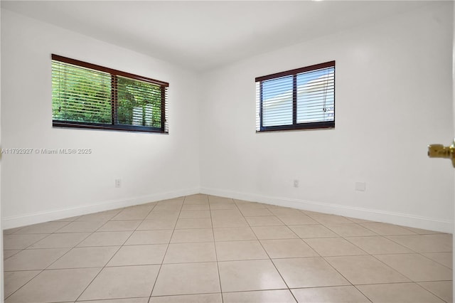 4515 SW 83rd Ave, Miami, FL 33155 - unfurnished room featuring light tile patterned floors, baseboards, and a wealth of natural light