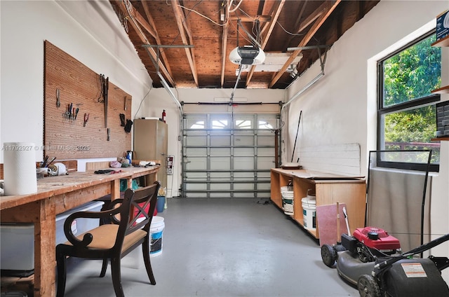 4515 SW 83rd Ave, Miami, FL 33155 - garage featuring a garage door opener and a workshop area