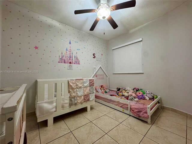 7514 NW 177th Ter Unit 7514, Hialeah, FL 33015 - bedroom featuring a ceiling fan, baseboards, and light tile patterned floors
