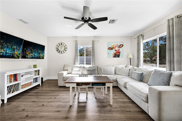 1595 NE 174th St, North Miami Beach, FL 33162 - living room featuring wood finished floors, ceiling fan, healthy amount of natural light, baseboards, and a textured ceiling