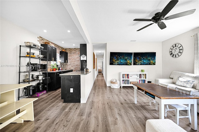 1595 NE 174th St, North Miami Beach, FL 33162 - kitchen featuring dark cabinetry, light wood-style floors, light countertops, a ceiling fan, and recessed lighting