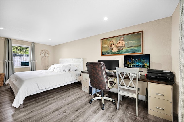 bedroom featuring recessed lighting and wood finished floors