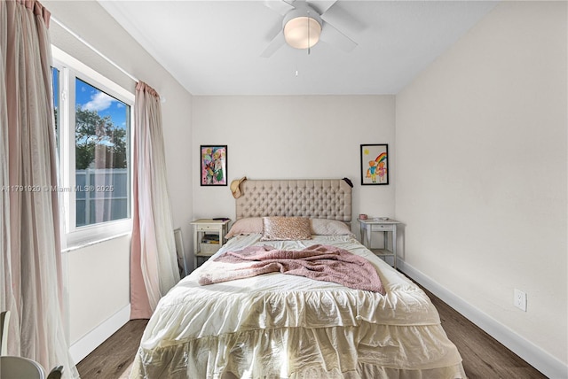 bedroom with baseboards, a ceiling fan, and wood finished floors