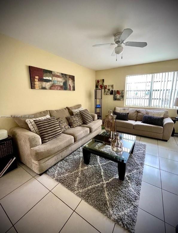 tiled living area featuring a ceiling fan