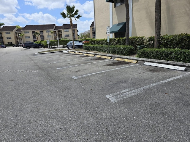 15320 SW 106th Ter Unit 1108, Miami, FL 33196 - uncovered parking lot featuring a residential view