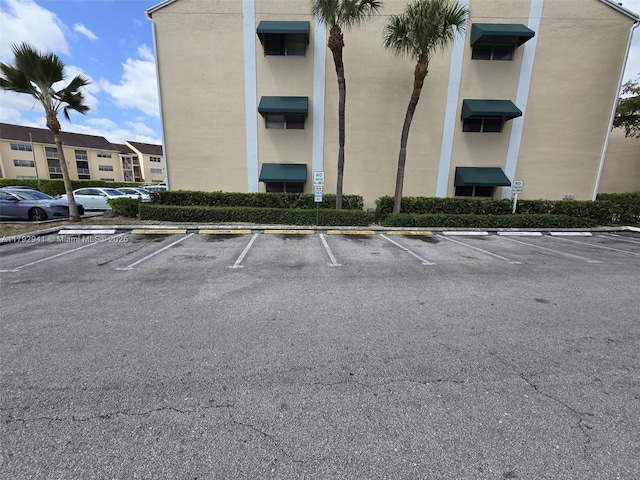 15320 SW 106th Ter Unit 1108, Miami, FL 33196 - view of building exterior with uncovered parking
