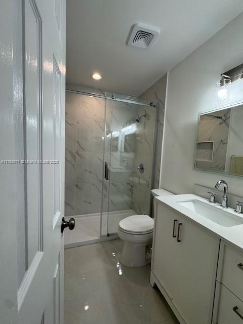 13333 SW 112th Pl, Miami, FL 33176 - full bath featuring visible vents, vanity, toilet, a marble finish shower, and recessed lighting