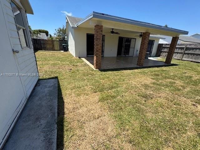 13333 SW 112th Pl, Miami, FL 33176 - exterior space featuring a fenced backyard, ceiling fan, a patio area, and a yard