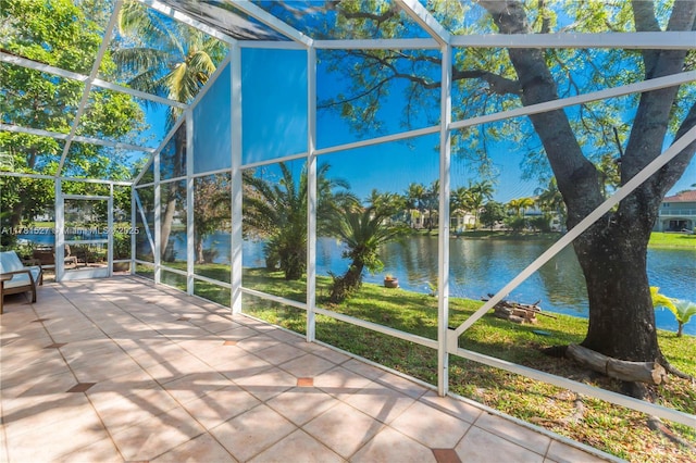 unfurnished sunroom with a water view