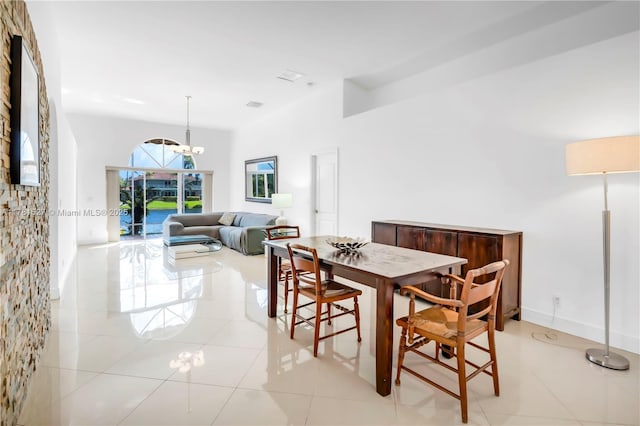 dining room with an inviting chandelier and light tile patterned flooring