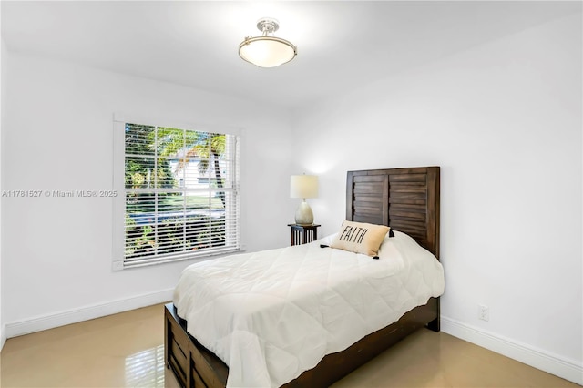 bedroom featuring baseboards